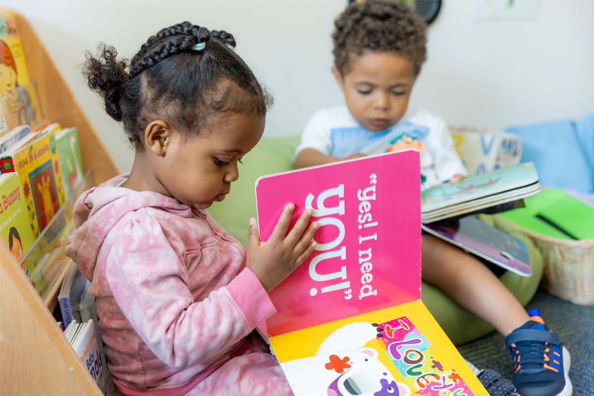 Children reading at the New E3 School.