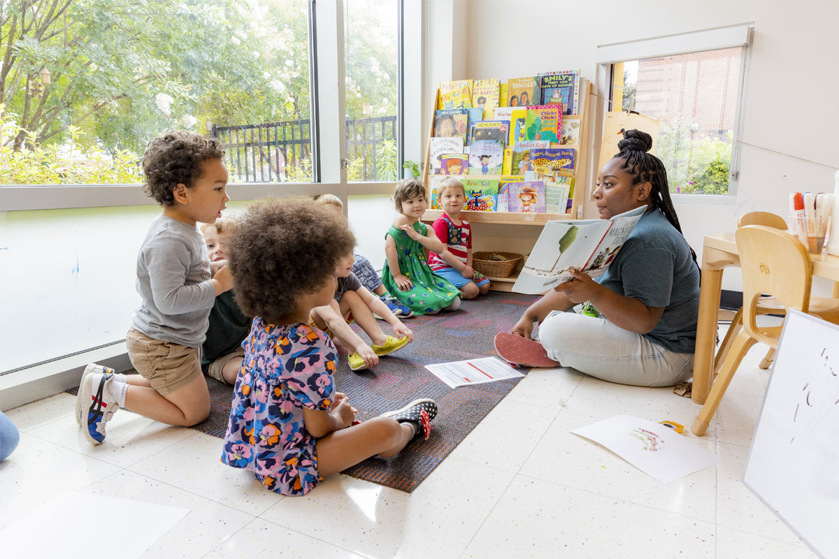 Teacher reading with students.