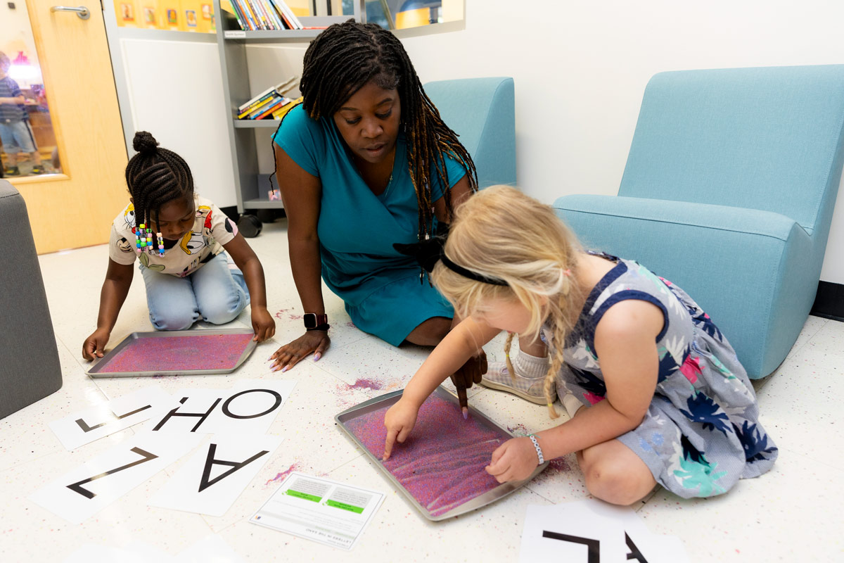 Students doing fun activities with their teacher.