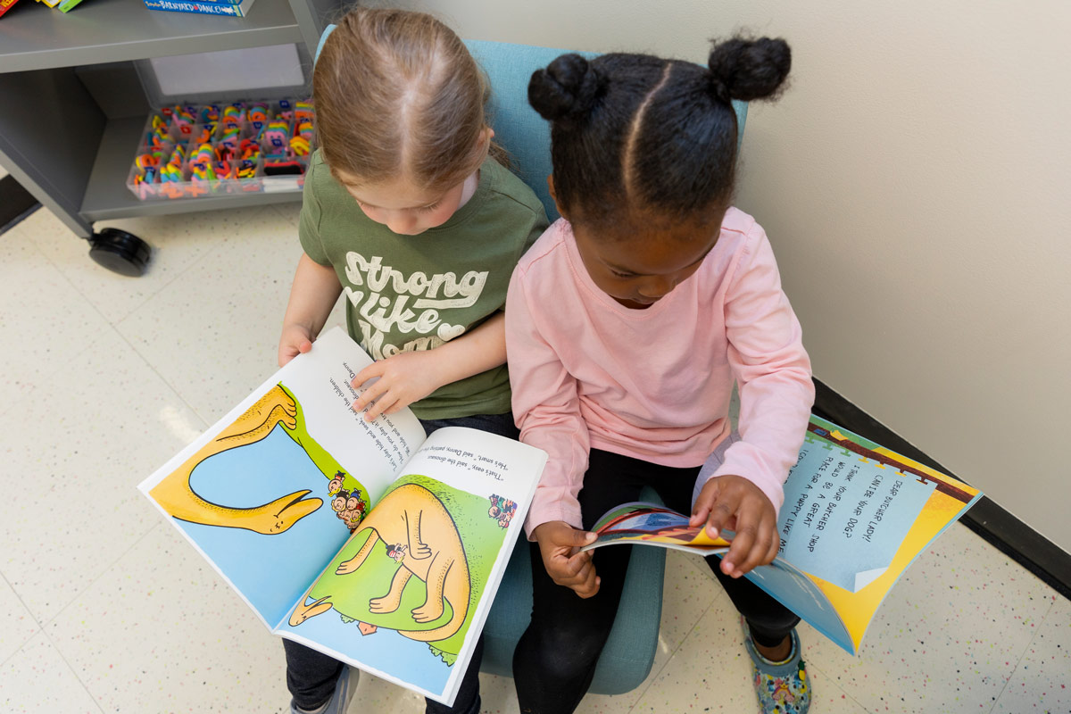 Students reading books together.