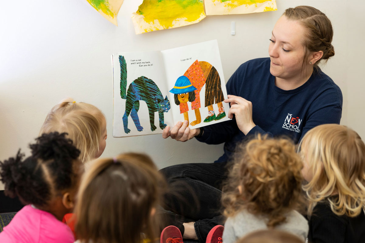 A teacher at the New E3 School reading Eric Carle to students.