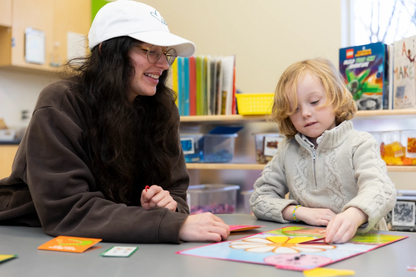 Teacher working with young students