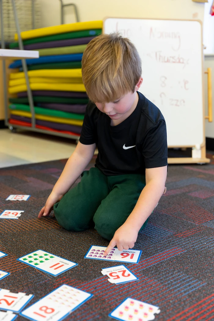 Teacher working with young students