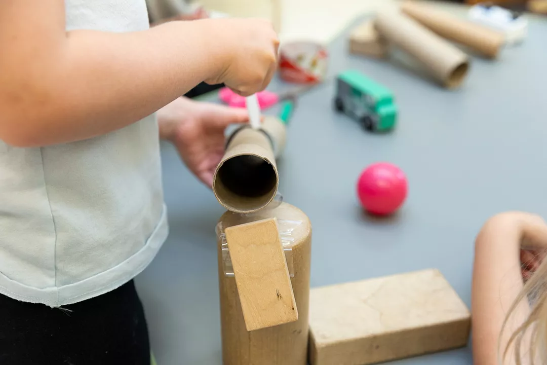 Teacher working with young students