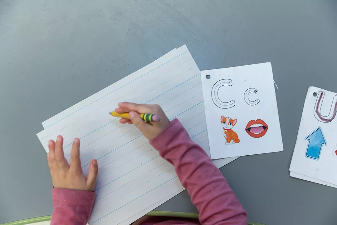 Students doing fun activities with their teacher.